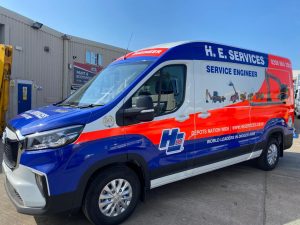 H. E. Services electric vans